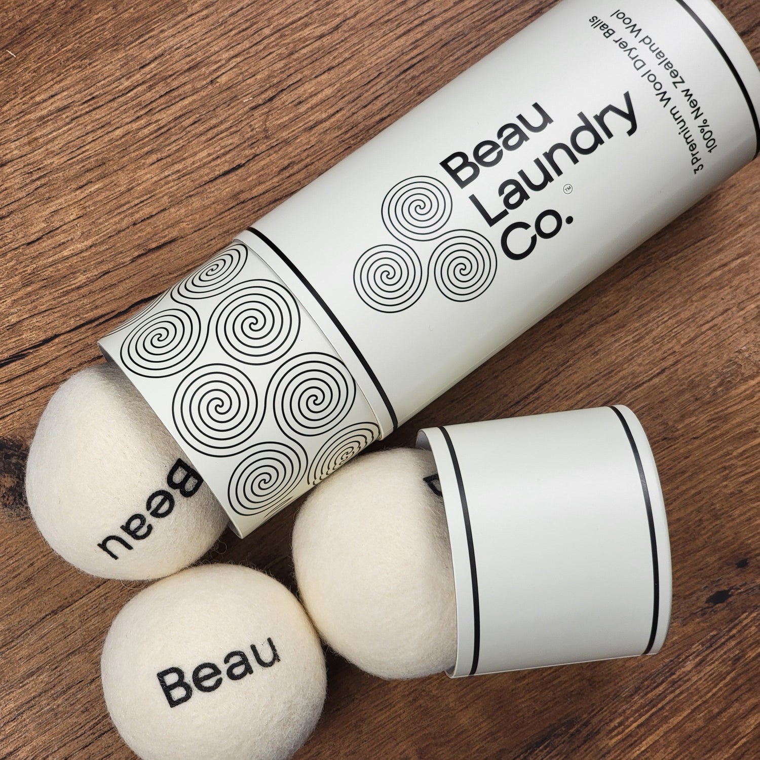 Three Beau Laundry Co Wool Dryer Ball Tubes Sitting on a Table